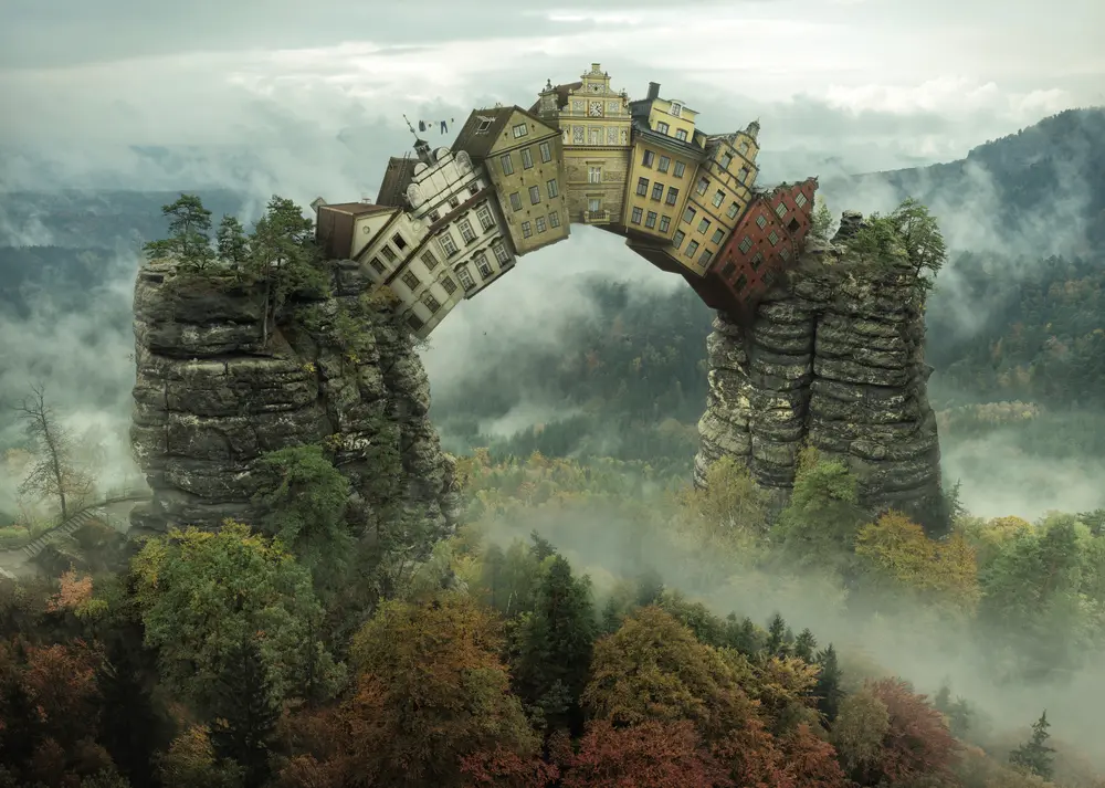 Fantasy art - a bridge of houses. Downloaded from Wallhaven. Author and rights unknown - please get in touch for crediting, or if there's any issue.