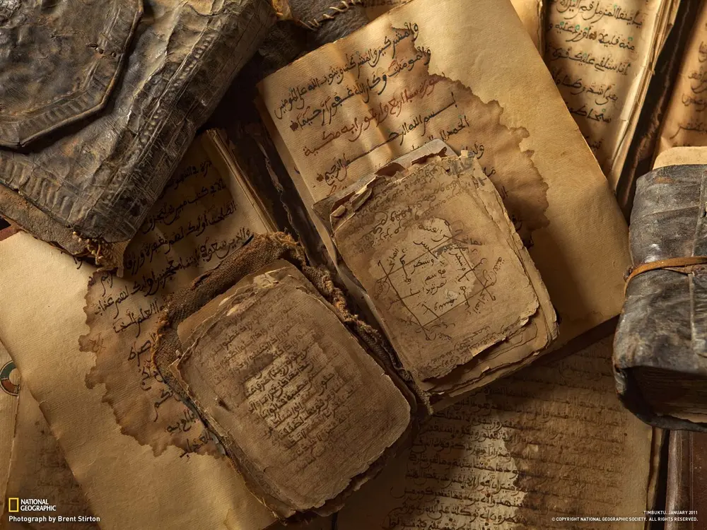 Archaic Arabic texts. Downloaded from Wallhaven. Author - Brent Stirton, taken from the National Geographic.